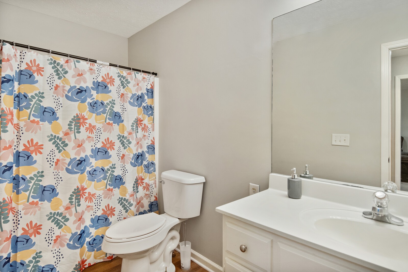 115 Poplar Street Portland, TN 37148 - Photo 11 of 17 a white toilet sitting next to a bathroom sink