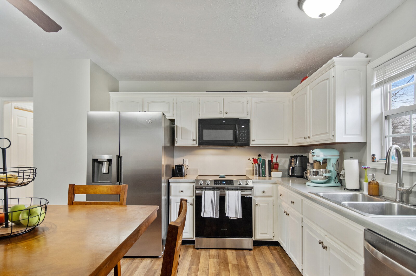 115 Poplar Street Portland, TN 37148 - Photo 14 of 17 a kitchen that has a lot of cabinets a sink and appliances