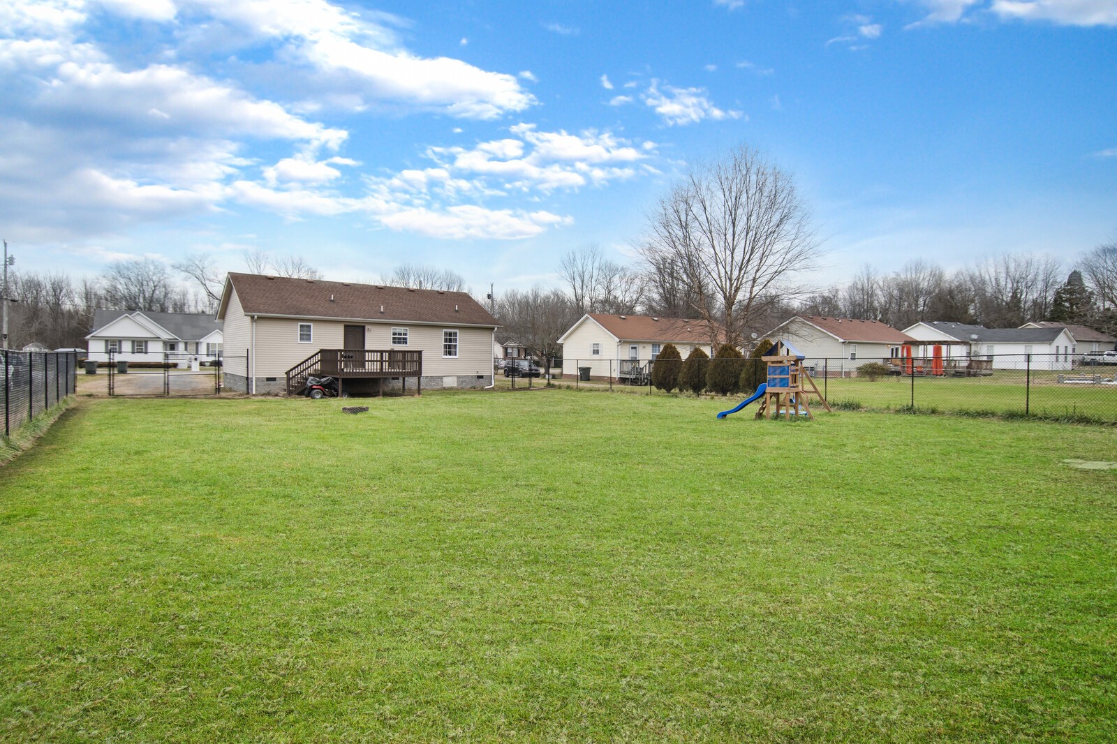 115 Poplar Street Portland, TN 37148 - Photo 3 of 17 a view of a house with a back yard