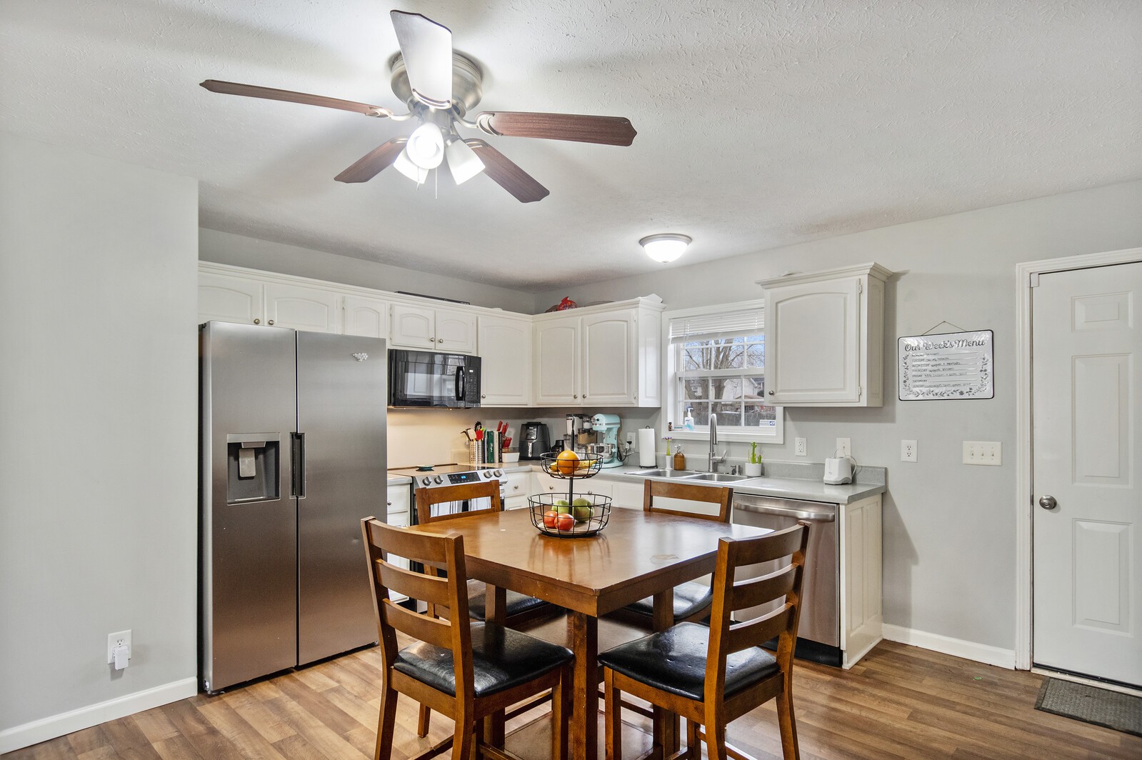115 Poplar Street Portland, TN 37148 - Photo 5 of 17 a kitchen with a dining table and chairs