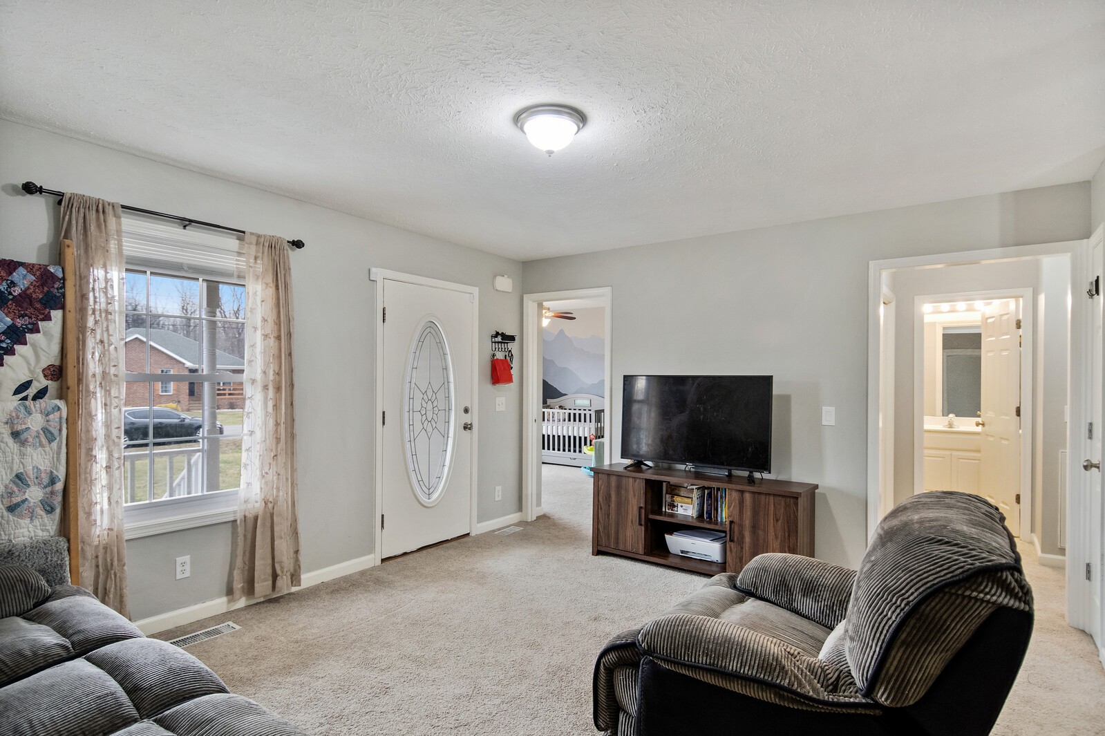 115 Poplar Street Portland, TN 37148 - Photo 6 of 17 a living room with furniture and a flat screen tv