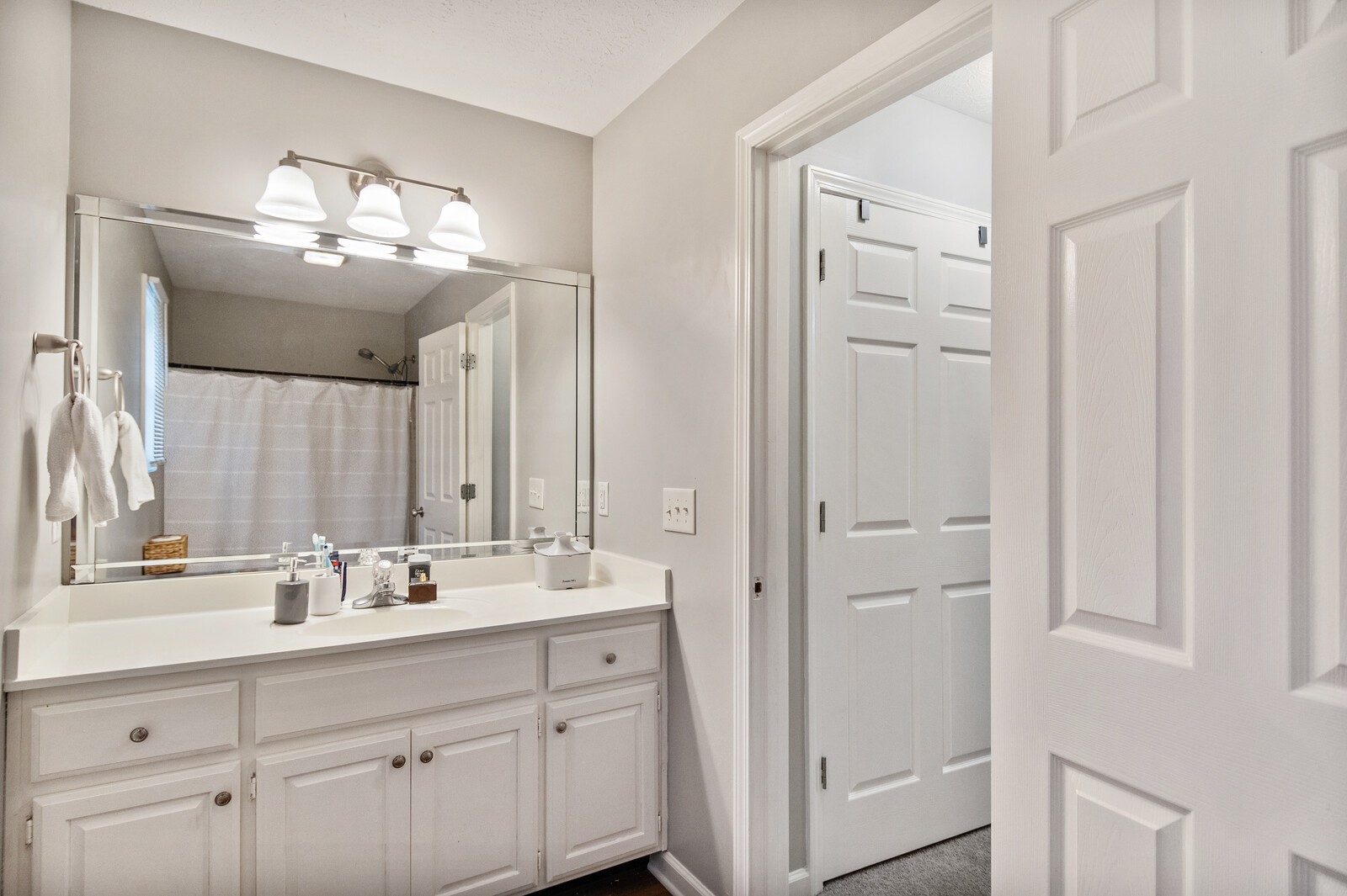 115 Poplar Street Portland, TN 37148 - Photo 8 of 17 a bathroom with double vanity sink a vanity and a mirror