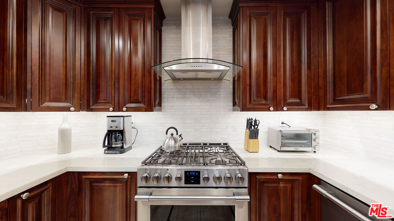 907 South Shenandoah Street, Unit 101 Los Angeles, CA 90035 - Photo 11 of 39 a kitchen with a stove and a sink