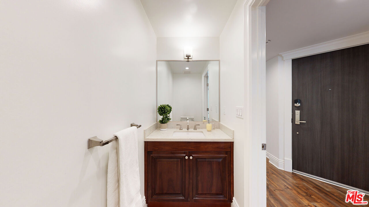 907 South Shenandoah Street, Unit 101 Los Angeles, CA 90035 - Photo 12 of 39 a bathroom with a sink and a mirror