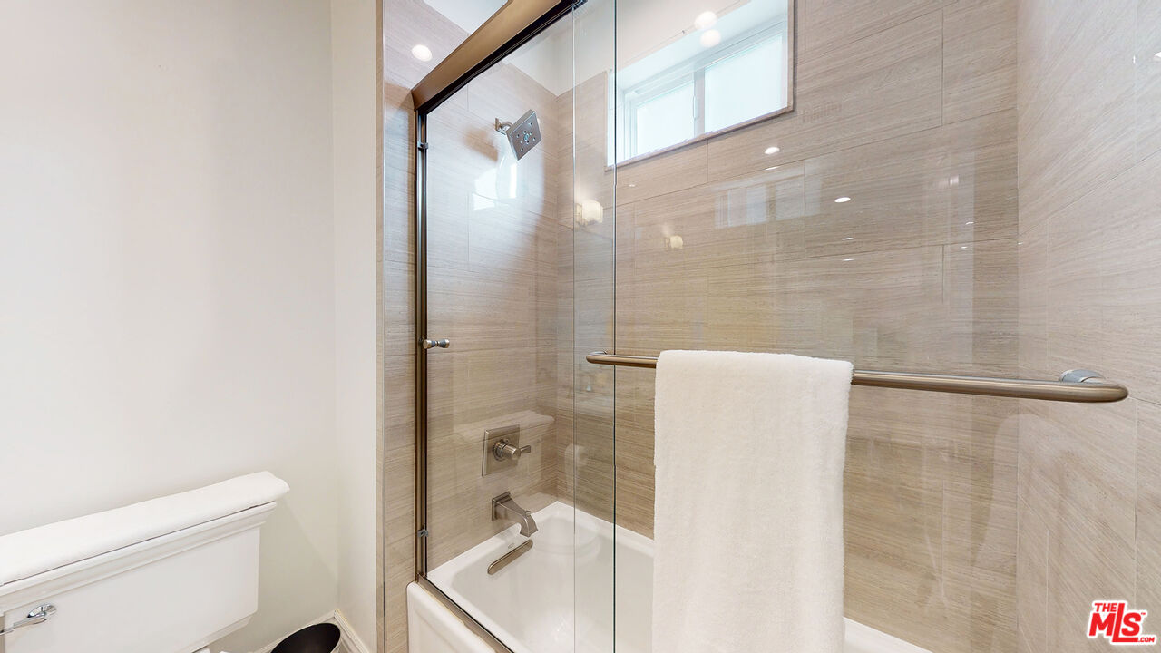 907 South Shenandoah Street, Unit 101 Los Angeles, CA 90035 - Photo 20 of 39 a bathroom with a shower and toilet