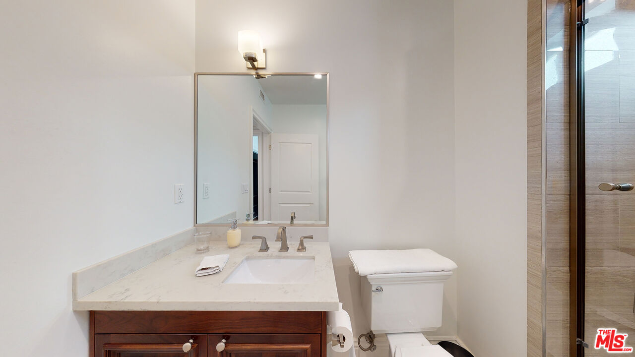 907 South Shenandoah Street, Unit 101 Los Angeles, CA 90035 - Photo 21 of 39 a bathroom with a sink and a toilet