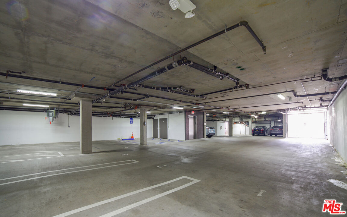 907 South Shenandoah Street, Unit 101 Los Angeles, CA 90035 - Photo 39 of 39 a view of parking garage with lots of white furniture