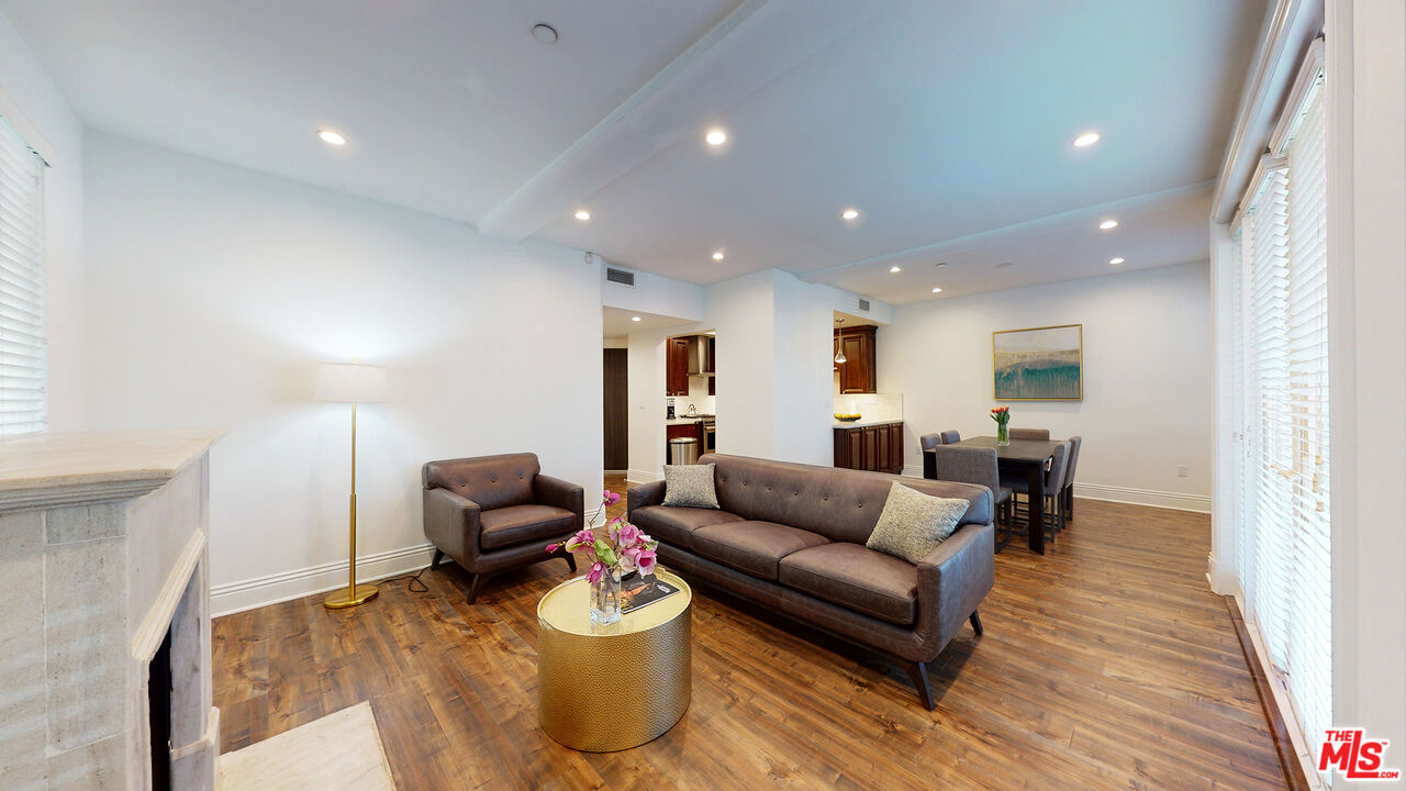 907 South Shenandoah Street, Unit 101 Los Angeles, CA 90035 - Photo 4 of 39 a living room with furniture and wooden floor