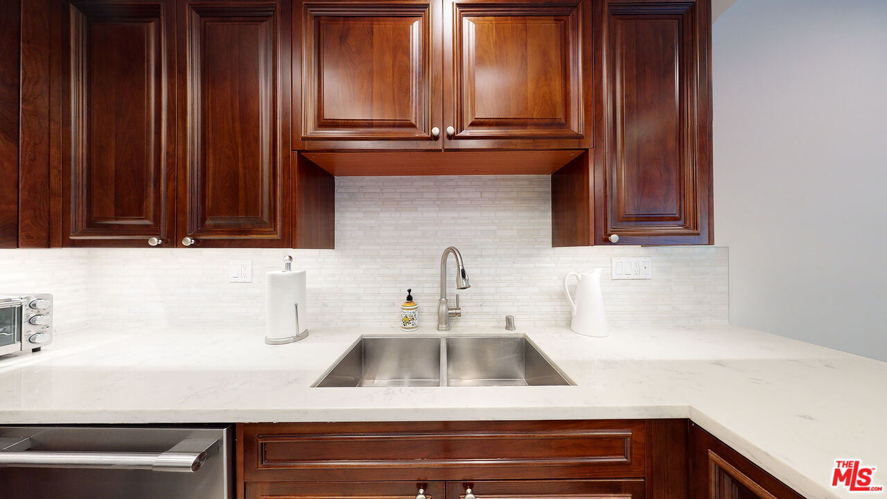 907 South Shenandoah Street, Unit 101 Los Angeles, CA 90035 - Photo 10 of 39 a kitchen with a sink and cabinets