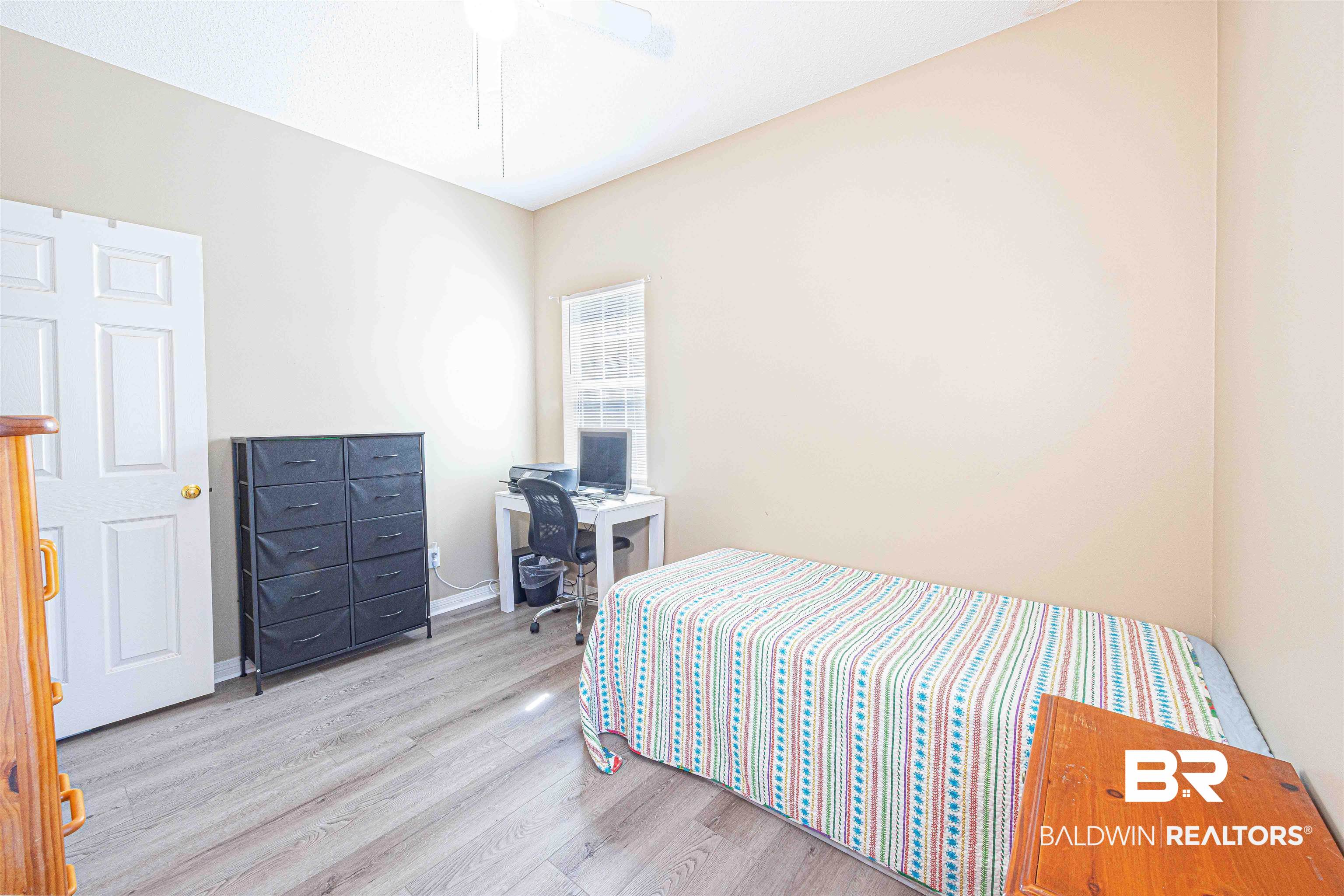 175 Montclair Loop Daphne, AL 36526 - Photo 24 of 44 Bedroom with wood finished floors, a desk, and ceiling fan