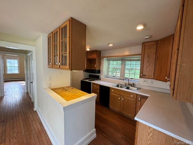 74 South Airmont Road Suffern, NY 10901 - Photo 14 of 42 Kitchen featuring wood-finish cabinetry, light-toned countertops, a gas range, a double basin sink, and recessed lighting