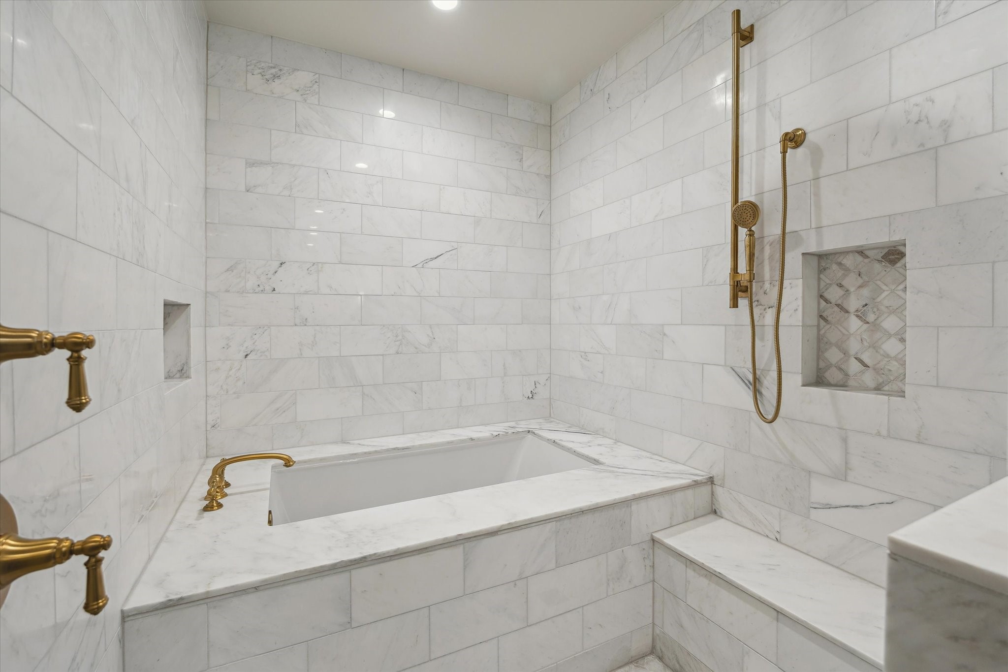 1717 Bissonnet Street, Unit 605 Houston, TX 77005 - Photo 17 of 32 Wet room with seamless marble tub surround, soaking tub and enclosed shower with bench.