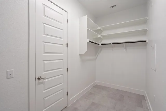 a bathroom with a granite countertop sink toilet a mirror and shower