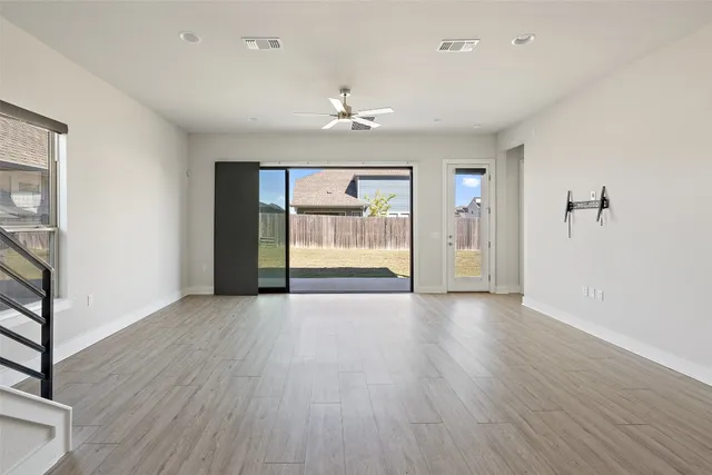a kitchen with stainless steel appliances a refrigerator and a stove top oven