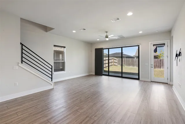 a kitchen with a sink and white cabinets