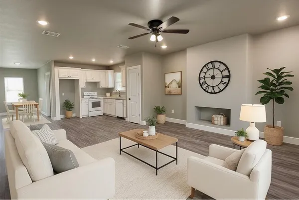 a living room with furniture a clock and a fireplace