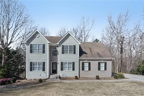 a front view of a house with a yard