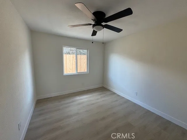a large kitchen with cabinets stainless steel appliances a sink and a window