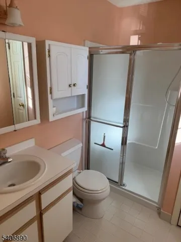 a white toilet sitting next to a bathroom sink