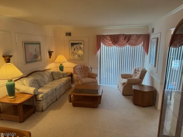 a living room with furniture and a lamp