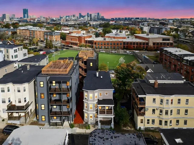 a kitchen with a sink and a refrigerator