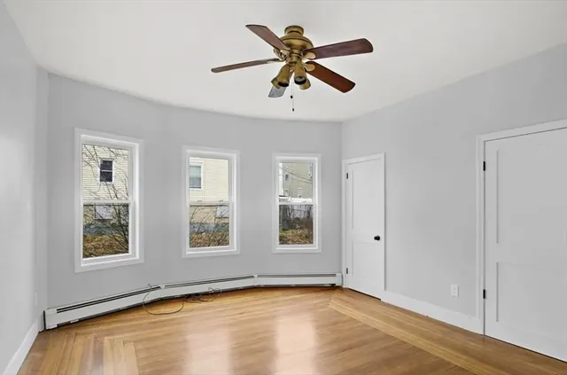 a bathroom with a sink toilet a mirror and shower