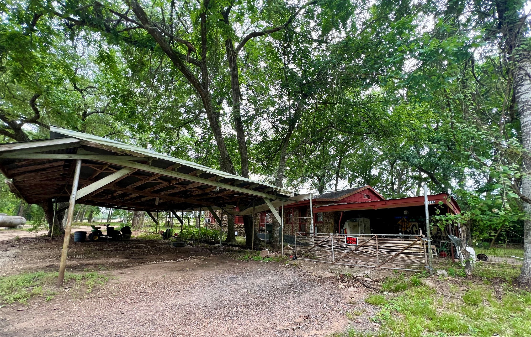 22606 Farm To Market 359 Hempstead, TX 77445 - Photo 14 of 26 Gated fenced in yard at the rock house.
