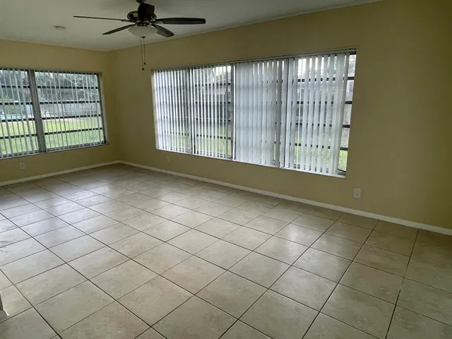 a view of an empty room and a window