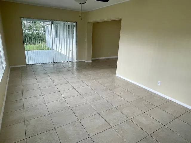 a view of an empty room and window