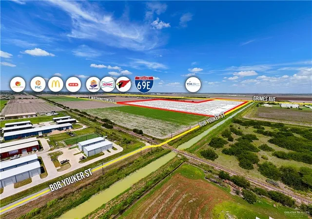 a view of swimming pool with a dining table and chairs with wooden floor
