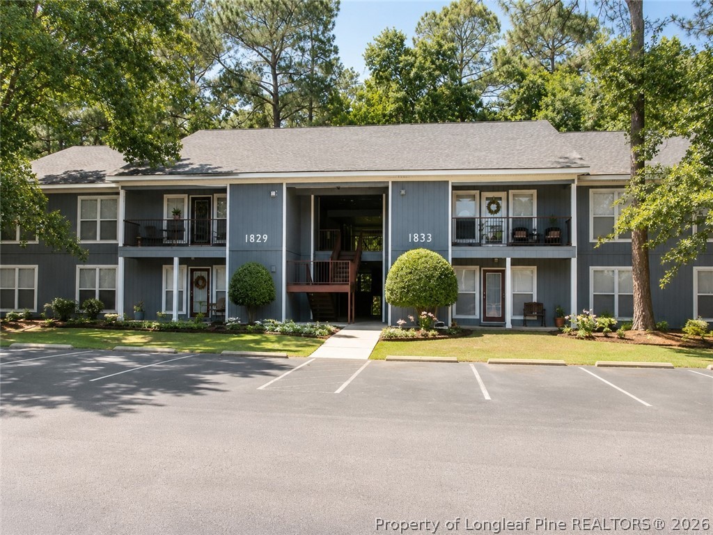 1833 Sardonyx Road, Unit 3 Fayetteville, NC 28303 - Photo 1 of 10 a front view of a residential apartment building with a yard