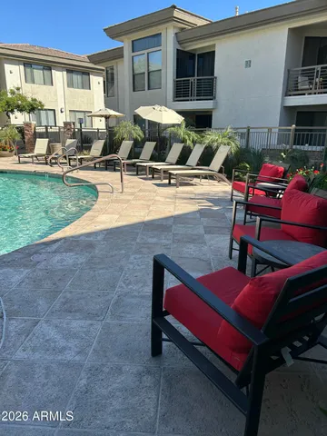 a outdoor space with patio the couches and a potted plant on the table
