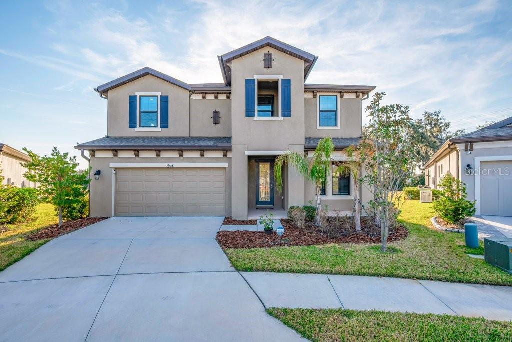 14604 Horse Trot Road Lithia, FL 33547 - Photo 5 of 62 a front view of a house with garden