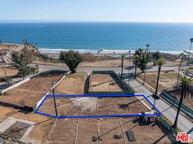 a view of swimming pool with seating space