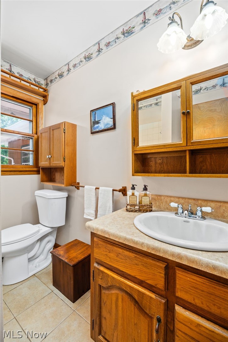 3070 Hamilton Road Medina, OH 44256 - Photo 29 of 34 Bathroom with wood-finish vanity, integrated sink, and light-toned countertop