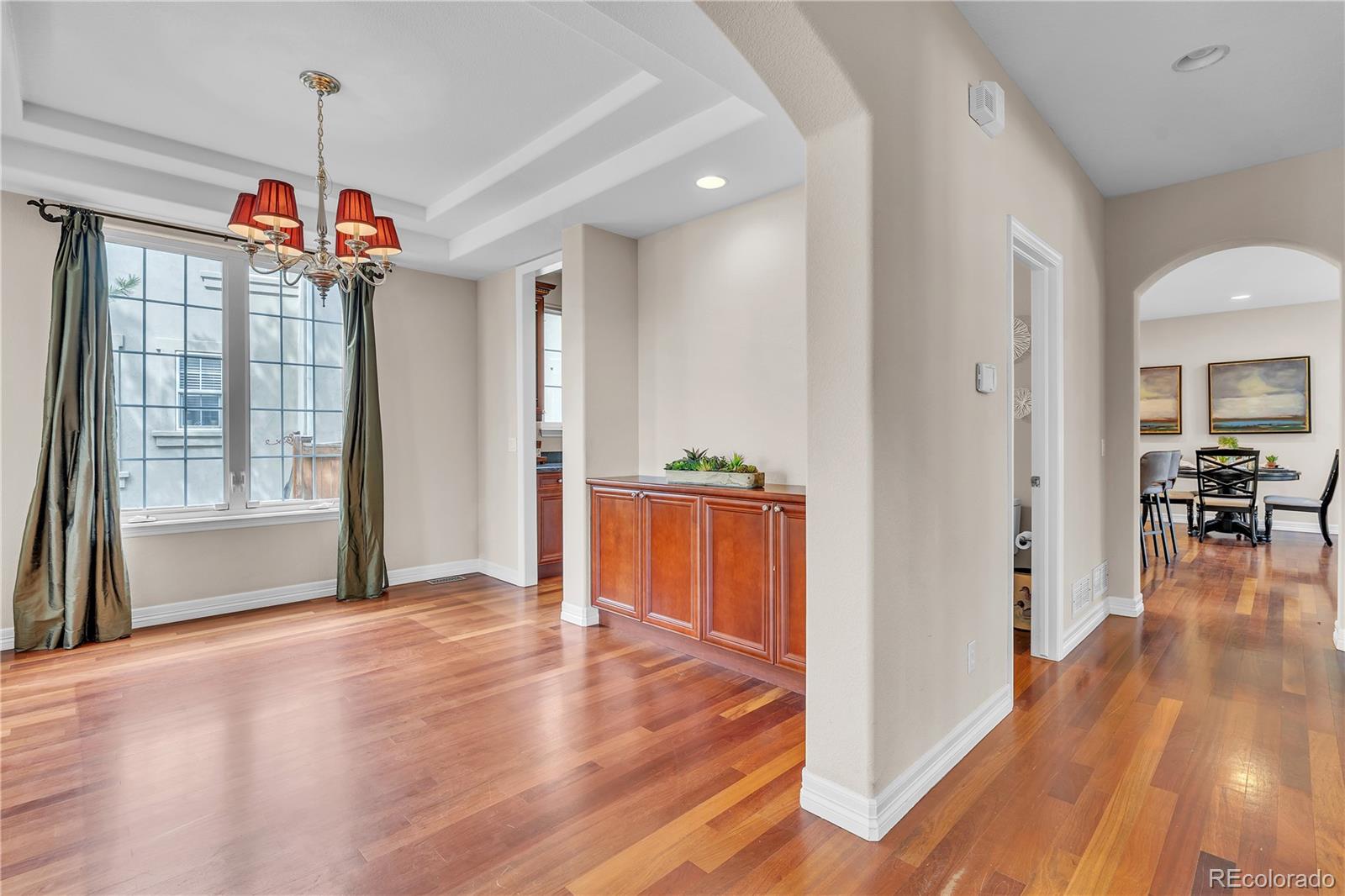 8053 East Maple Avenue Denver, CO 80230 - Photo 12 of 49 a view of a living room and kitchen