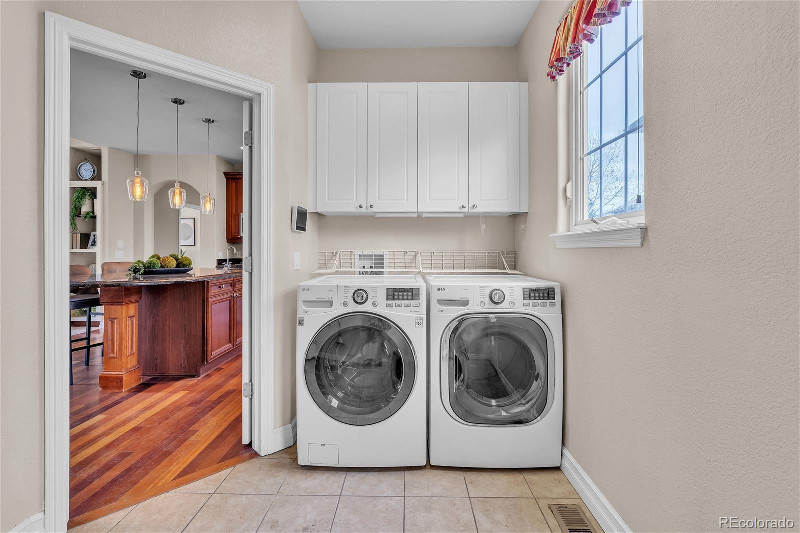 8053 East Maple Avenue Denver, CO 80230 - Photo 18 of 49 a utility room with dryer and washer