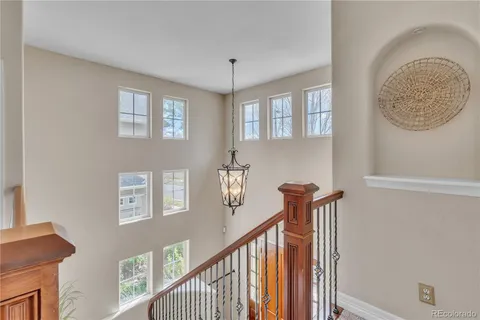 a bathroom with a granite countertop sink and a mirror a toilet
