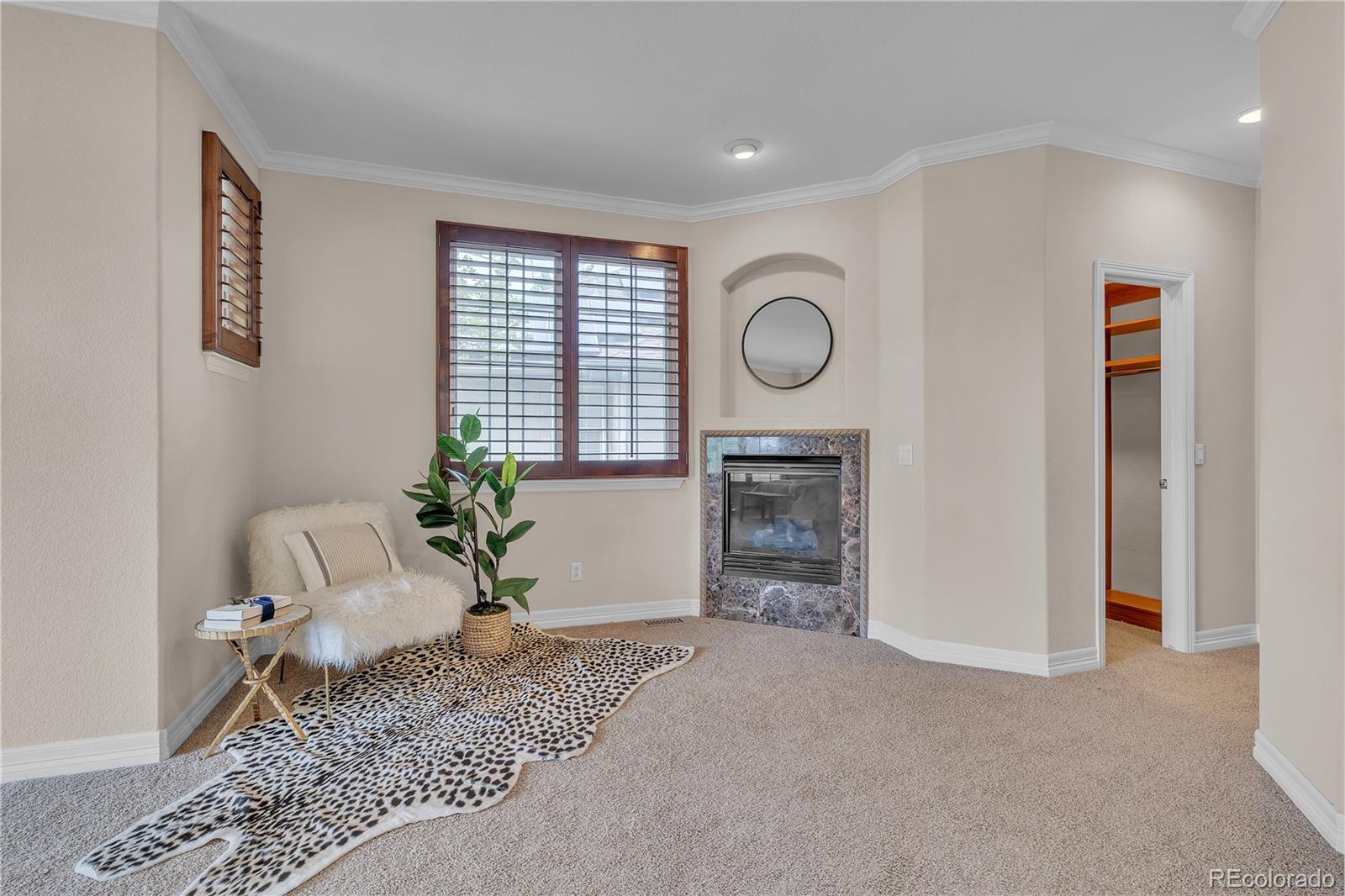 8053 East Maple Avenue Denver, CO 80230 - Photo 22 of 49 a living room with furniture and a fireplace