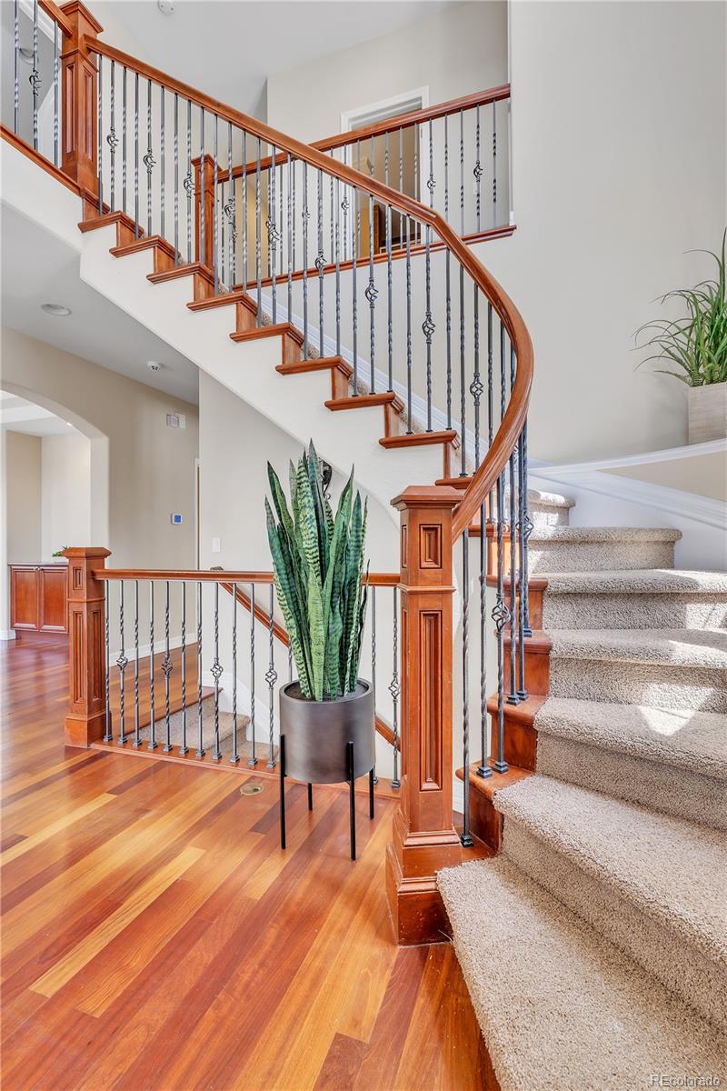 8053 East Maple Avenue Denver, CO 80230 - Photo 3 of 49 a view of entryway and hall with wooden floor