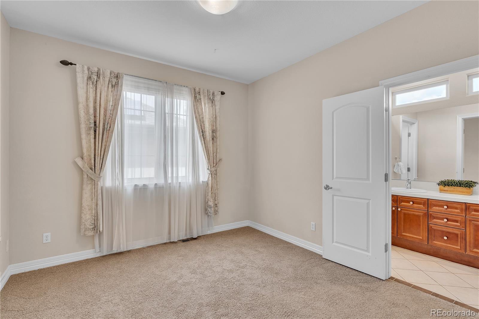 8053 East Maple Avenue Denver, CO 80230 - Photo 33 of 49 a view of an empty room and window