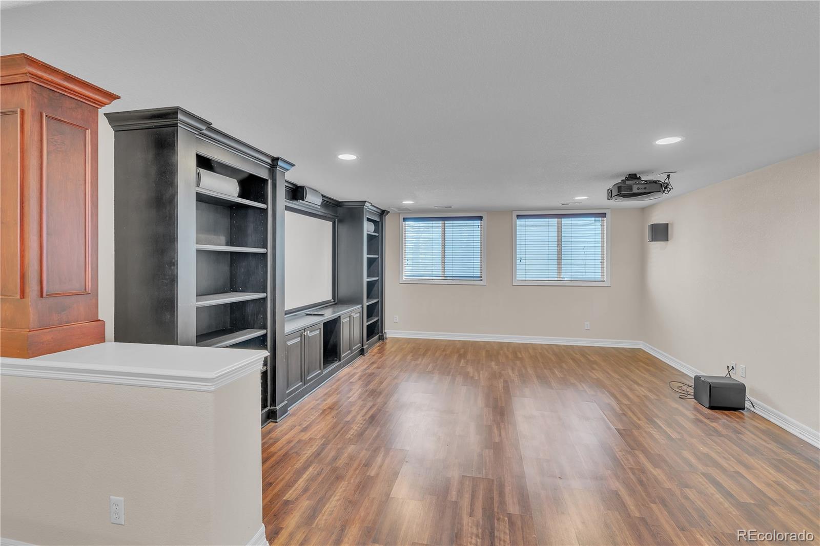 8053 East Maple Avenue Denver, CO 80230 - Photo 39 of 49 a kitchen with a refrigerator and a stove top oven