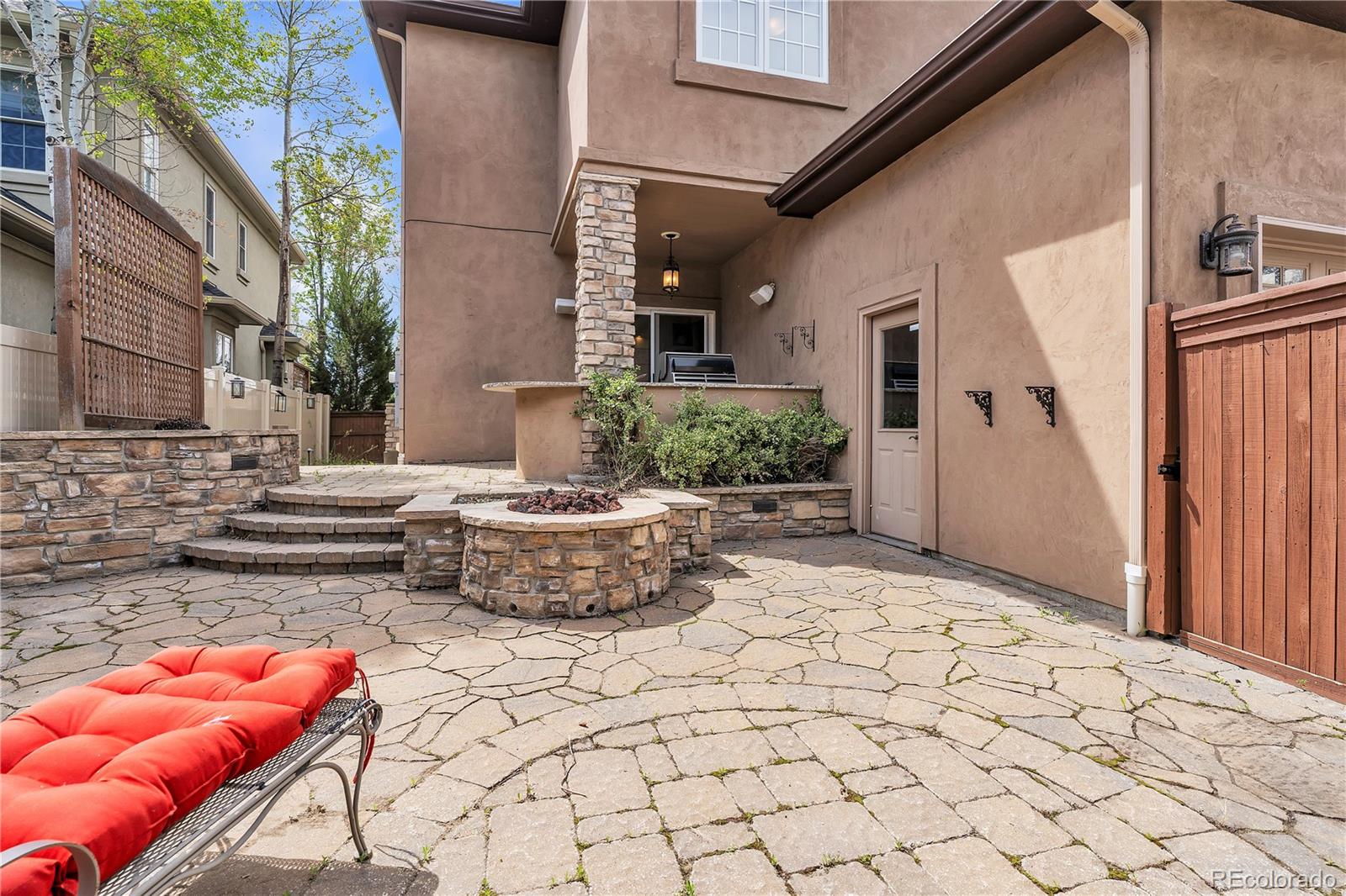 8053 East Maple Avenue Denver, CO 80230 - Photo 44 of 49 a backyard of a house with outdoor seating