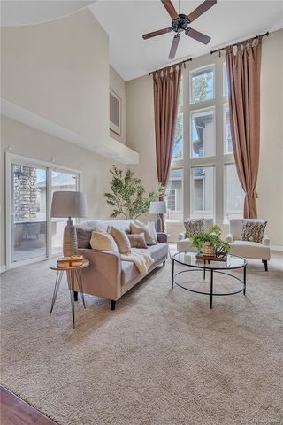a view of a living room and kitchen