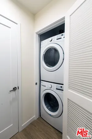 a view of a hallway with washer and dryer