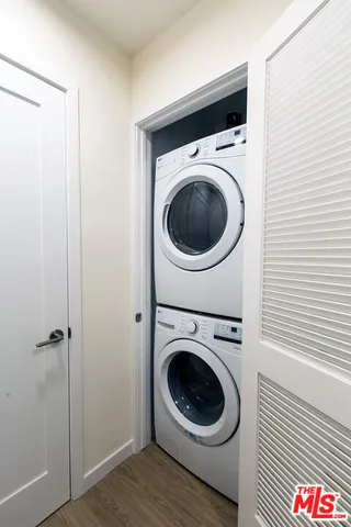a view of a hallway with washer and dryer