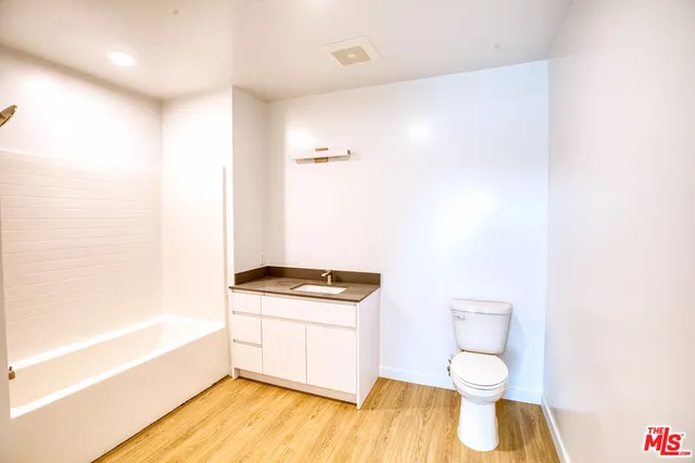 a bathroom with a toilet a sink and a bathtub