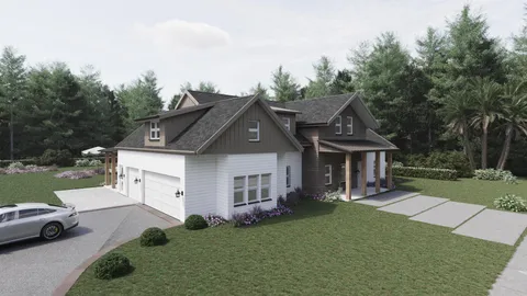 a front view of a house with a garden and trees