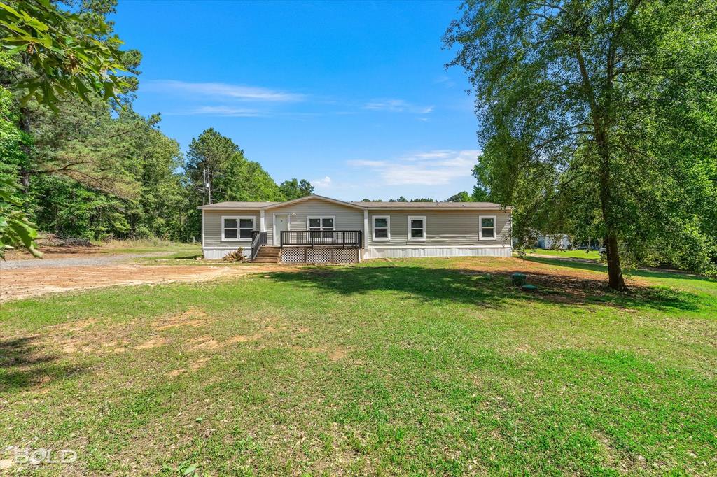 2153 Highway 2 Plain Dealing, LA 71064 - Photo 3 of 39 a front view of a house with a yard