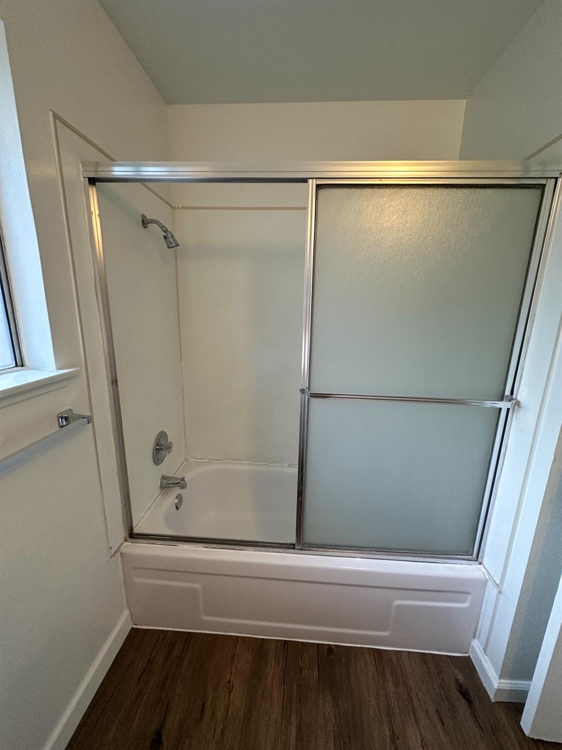 1069 Cherry Lane, Unit D Clovis, CA 93612 - Photo 11 of 18 a bathroom with a shower and a bath tub